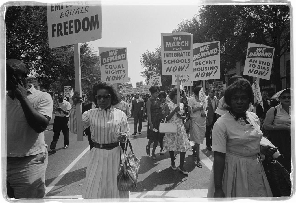 Marchers carrying signs for equal rights, integrated schools and decent housing, March on Washington, 28 August 1963